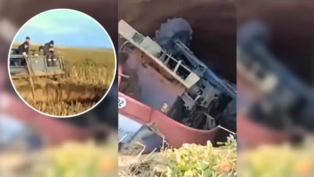 Un agricultor conduce su cosechadora por su campo cuando es engullido por un enorme socavón