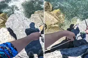 peces rodean pescador Huelva